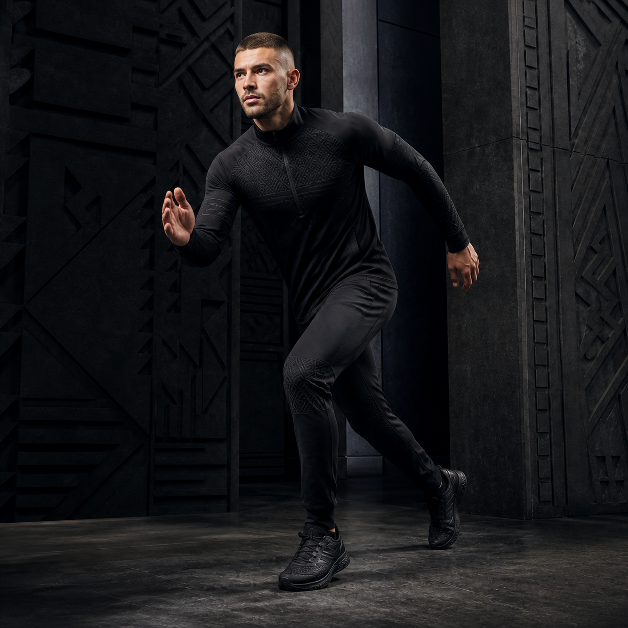 Male model moving in graphite FLY³ performance apparel